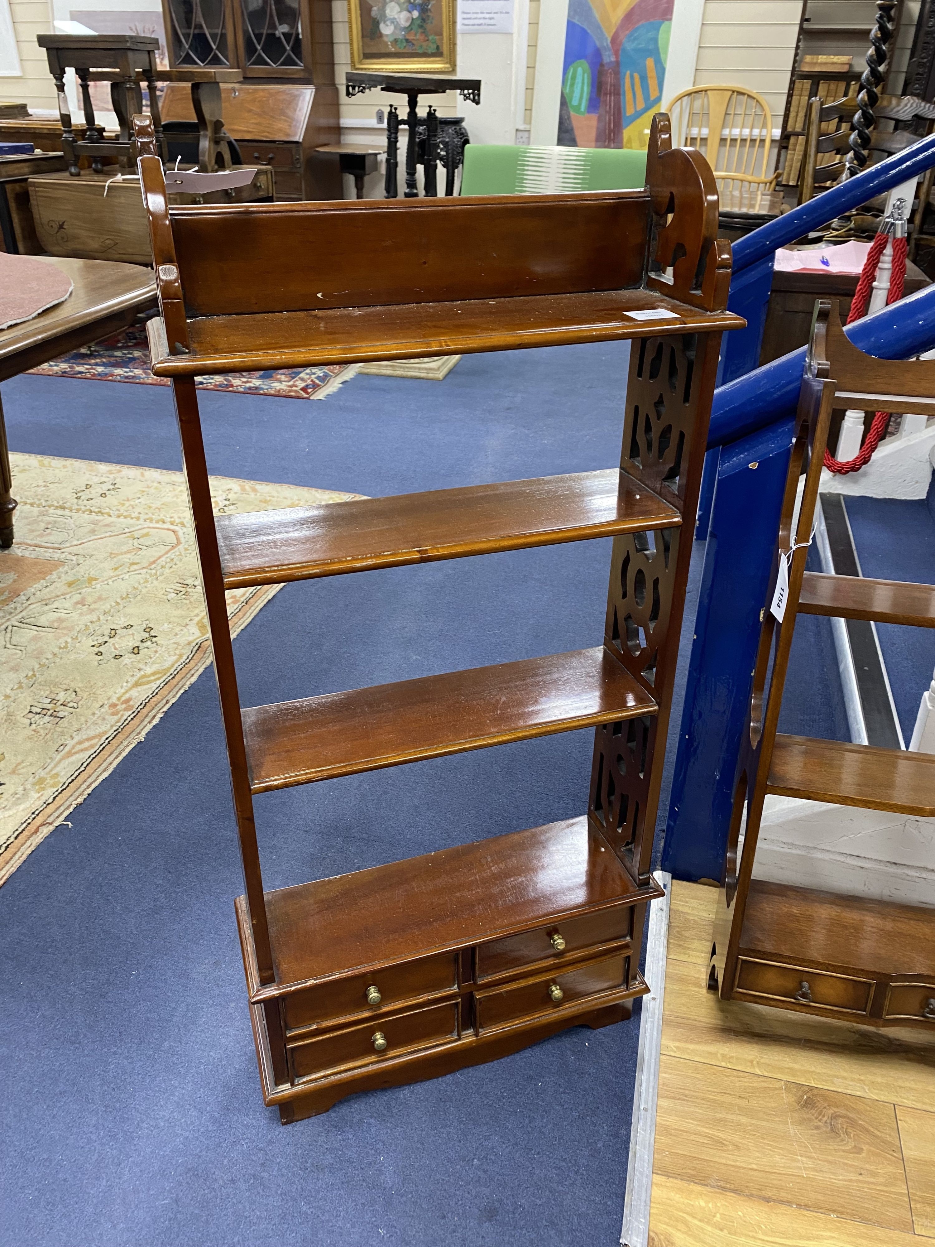Two mahogany wall brackets, larger width 69cm, height 93cm
